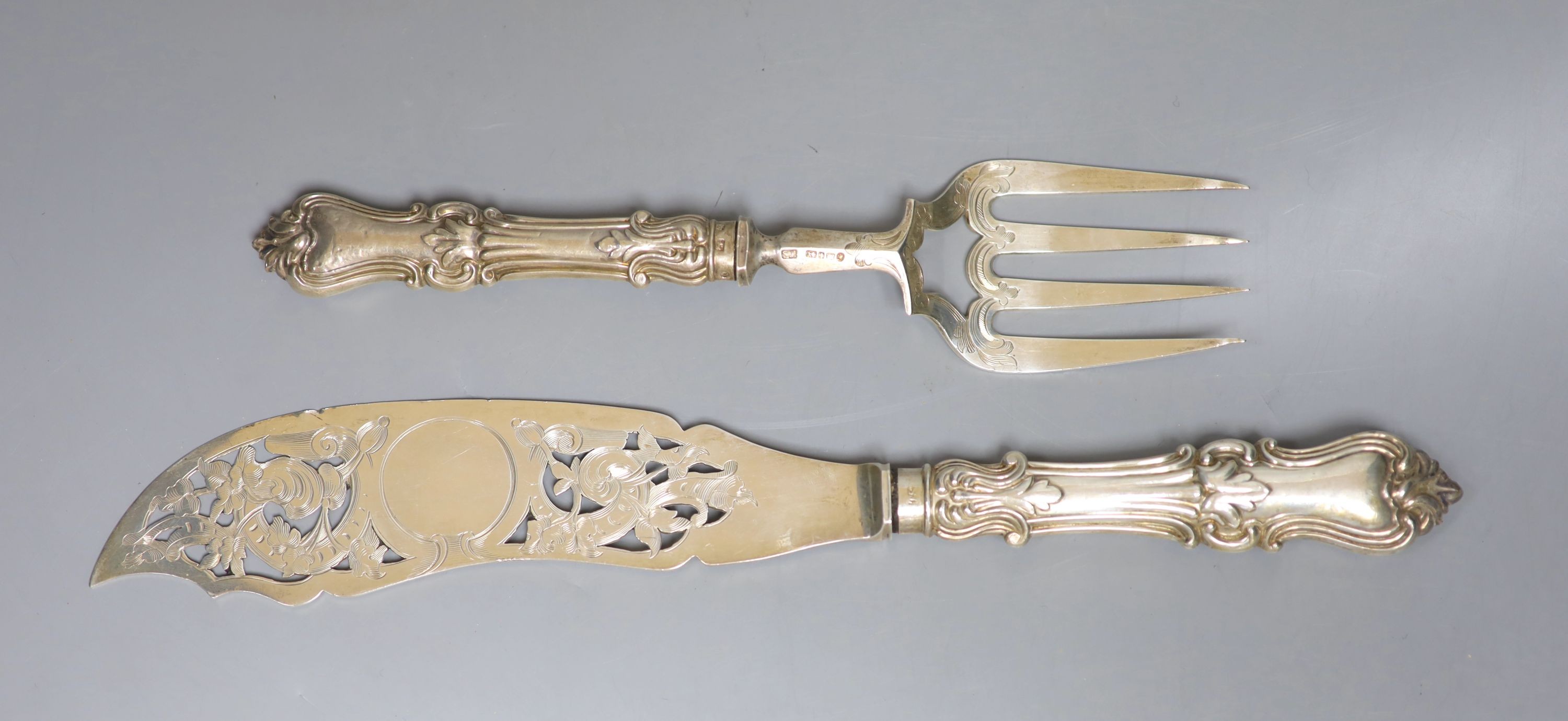 A pair of Victorian silver fish servers, Thomas Sansom, Sheffield, 1852, knife 33.5cm, loaded handles.